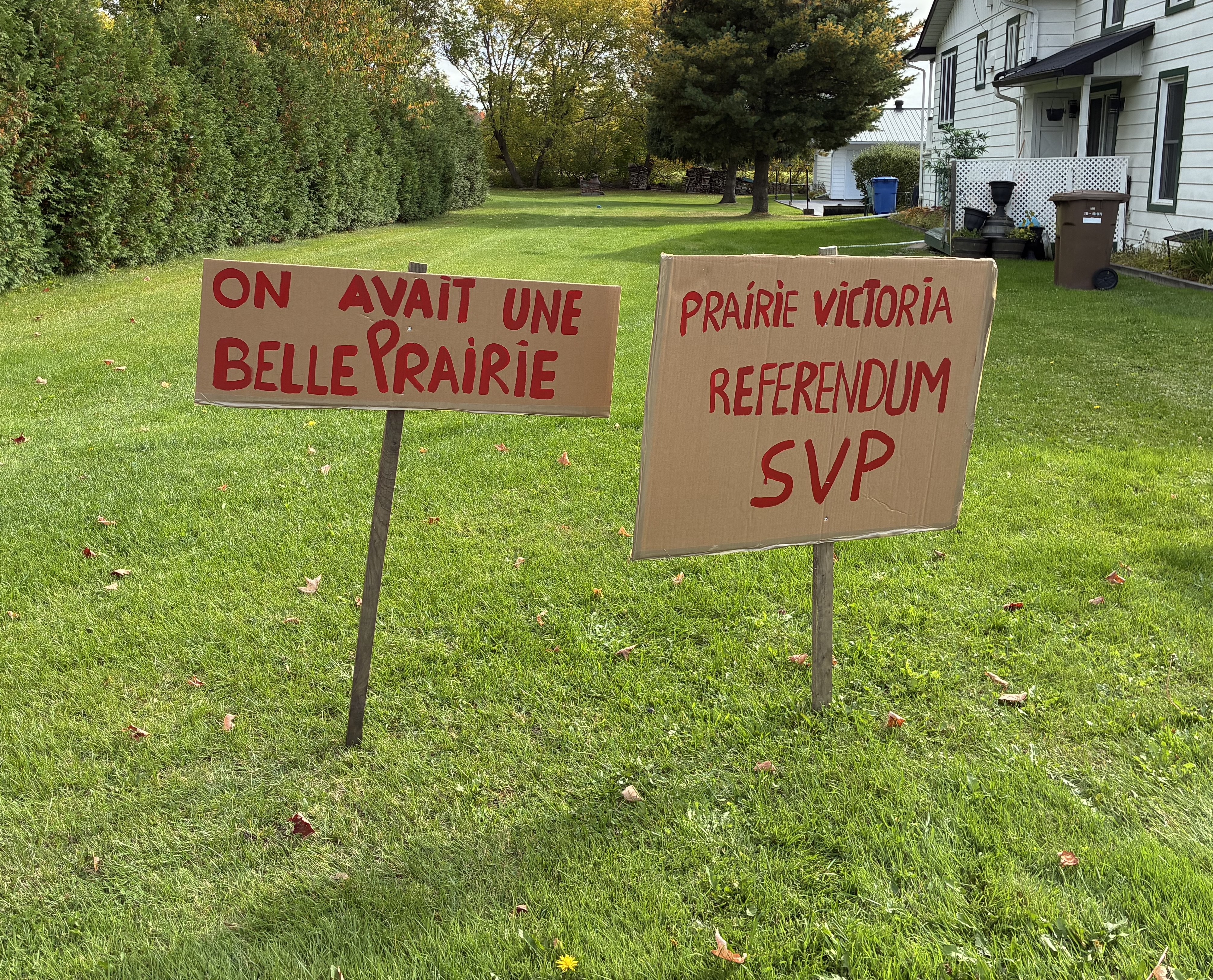 Signs calling for discussion about Prairie
                Victoria